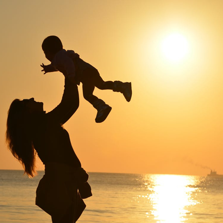 Mother and child, sea, sunset